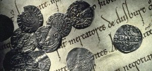Duisburger Silberpfennige auf einer Urkunde von 1155