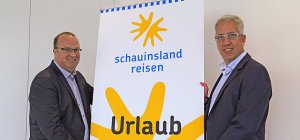 Gerald Hassner und Detlef Schroer präsentieren das neue Logo